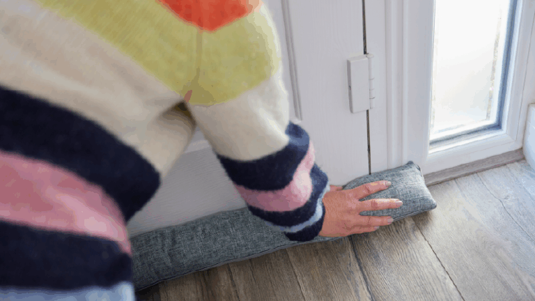 woman putting a door stopper by the front door
